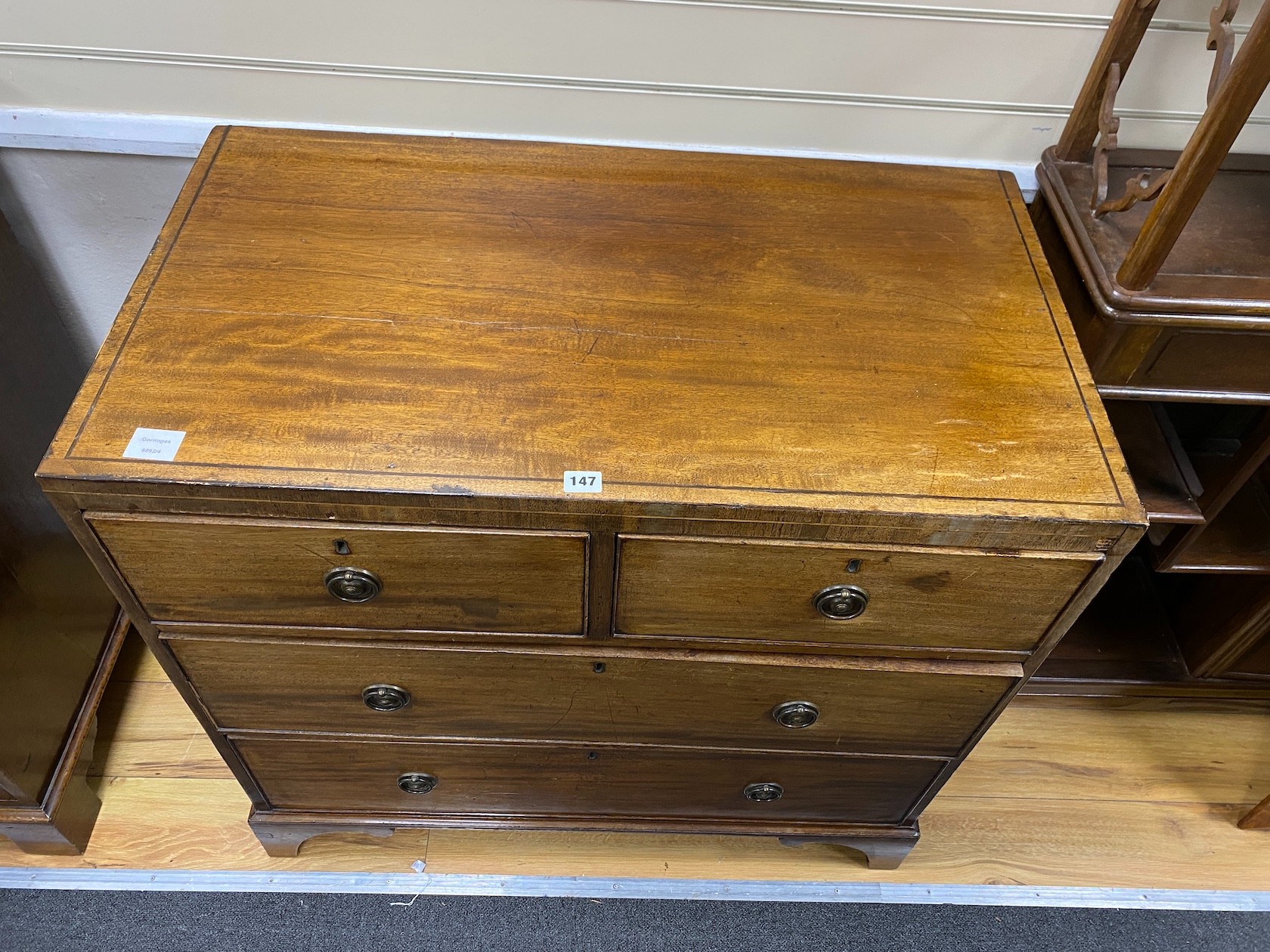A small George IV mahogany chest of two short and two long drawers, width 90cm, depth 50cm, height 88cm